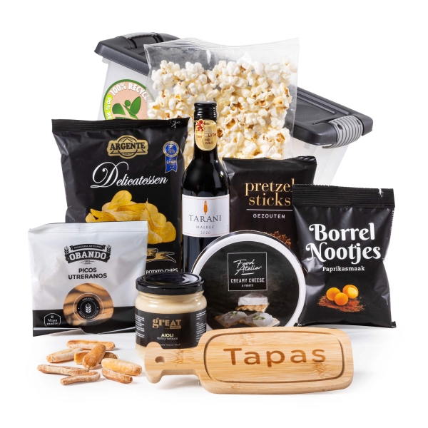 Kerstpakketten houten plank met Spaanse tapas.